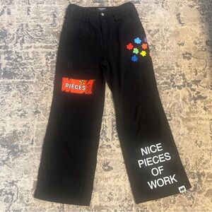 11KN Black Cargo Pants Size medium Stars Pass By Leave Traces Puzzles